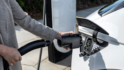 The Hyundai NACS adapter being plugged into a 2024 IONIQ 5.