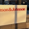 A person walks by the Johnson & Johnson headquarters is in New Brunswick, N.J., on Thursday, Feb. 8, 2024.