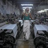Abdul Sattar, 70, operates a power loom at a workshop in Bhiwandi, India, Feb. 25, 2025.