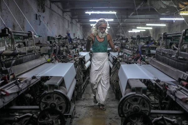 Abdul Sattar, 70, operates a power loom at a workshop in Bhiwandi, India, Feb. 25, 2025.