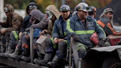In this Oct. 15, 2014 photo, coal miners return on a buggy after working a shift underground at the Perkins Branch Coal Mine in Cumberland, Ky.