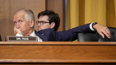 Sen. Thom Tillis, R-N.C., listens as U.S. Trade Representative Jamieson Greer testifies before the Senate Finance Committee, Washington, April 8, 2025.