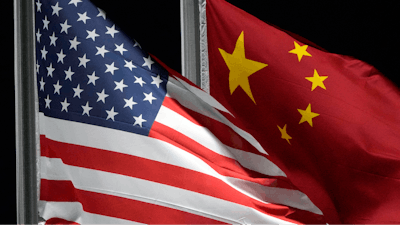 The American and Chinese flags wave at Genting Snow Park ahead of the 2022 Winter Olympics, Feb. 2, 2022, in Zhangjiakou, China.