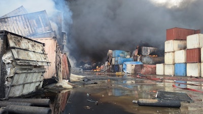 Containers burn, Sunday, April 27, 2025, after a massive explosion and fire rocked a port near the southern port city of Bandar Abbas, Iran, on Saturday.