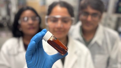 Dr Nimesha Rathnayake and Professor Kalpit Shah with Dr Ramandeep Kaur, who holds a vial of the team’s bio-oil.