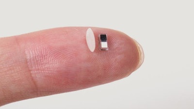 The tiny pacemaker sits next to a single grain of rice on a fingertip. The device is so small that it can be non-invasively injected into the body via a syringe.