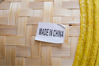 A made in China sticker is displayed on a hat at a store in Chinatown in San Francisco, April 18, 2025.