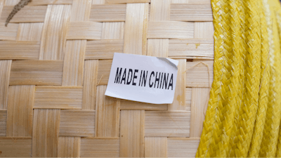A made in China sticker is displayed on a hat at a store in Chinatown in San Francisco, April 18, 2025.