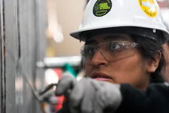 Carol Otarola practices caulking during an Ironworkers Local 63 pre-apprenticeship class Wednesday, March 26, 2025, in Broadview, Ill.