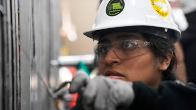 Carol Otarola practices caulking during an Ironworkers Local 63 pre-apprenticeship class Wednesday, March 26, 2025, in Broadview, Ill.
