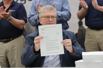 In this photo provided by Tennessee Valley Authority, Scott Hunnewell, vice president of the utility’s New Nuclear Program, signs the construction permit application to build a small modular reactor, Monday, May 19, 2025, in Chattanooga, Tenn.