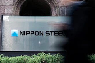 A person walks past a Nippon Steel Corporation sign at the company headquarters on Jan. 7, 2025, in Tokyo.
