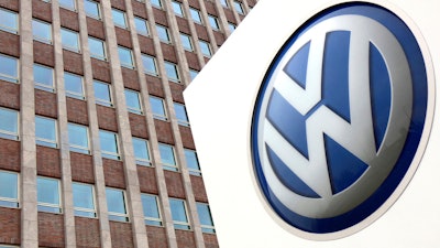 In this April 13, 2018 file photo, Volkswagen logo is pictured in front of a company building in Wolfsburg, Germany.