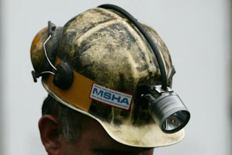 A miner gathers his thought before taking part in a rescue mission, Tuesday, Jan. 3, 2006, in Tallmansville, W.Va.