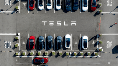 Tesla vehicles line a parking lot at the company's Fremont, Calif., factory on Sept. 18, 2023.