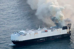 In this photo provided by the U.S. Coast Guard, smoke rises from cargo vessel Morning Midas approximately 300 miles south of Adak, Alaska, June 3, 2025, as the crew of a cargo ship carrying around 3,000 vehicles to Mexico, abandoned ship after they could not control a fire.