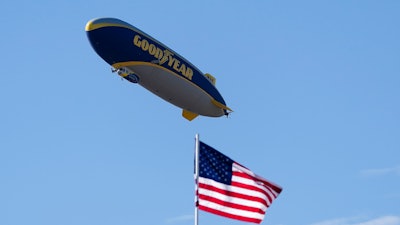 The Goodyear blimp hovers above the 16th hole during the Phoenix Open golf tournament, Sunday, Feb. 12, 2023, in Scottsdale, Ariz.