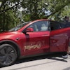 A rider boards a driverless Tesla robotaxi, a ride-booking service, Sunday, June 22, 2025, in Austin, Texas.