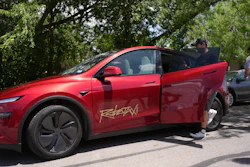 A rider boards a driverless Tesla robotaxi, a ride-booking service, Sunday, June 22, 2025, in Austin, Texas.