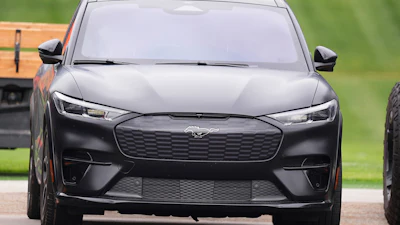 A Ford Mustang Mach-E sits in the players' parking lot Thursday, May 29, 2025, at the Denver Broncos' headquarters in Centennial, Colo.