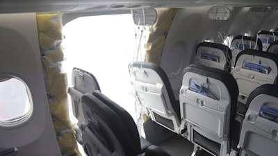 This image taken Jan. 7, 2024, and released by the National Transportation Safety Board, shows the section of a a Boeing 737 Max where a door plug fell while Alaska Airlines Flight 1282 was in flight.