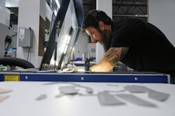Craig Simile, senior operations manager at Made Plus, prepares materials with a laser cutting machine at the company's manufacturing facility in Annapolis, Md., Tuesday, June 10, 2025.