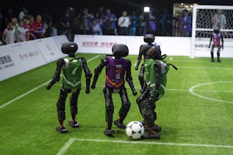 Teams using autonomous T1 robots from Booster Robotics compete in the inaugural RoBoLeague robot soccer competition held in Beijing, Saturday, June 28, 2025.
