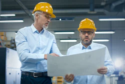 Two Employees At Logistics Center Warehouse Talk About The Plan On White Paper 838527590 3440x1935 (1)