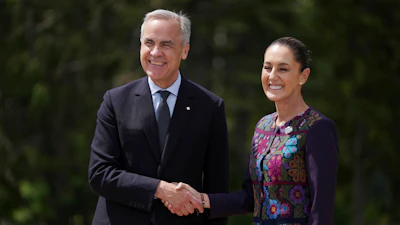 Canada's Prime Minister Mark Carney welcomes Mexican President Claudia Sheinbaum to the G7 Summit in Kananaskis, Alberta, June 17, 2025.