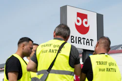 Strikers stand in front of the Birtat factory in Murr, Germany, Wednesday, Aug. 6, 2025.