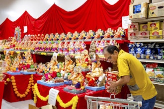 A worker stocks products at New India Bazar, Fremont, Calif., Aug. 6, 2025.