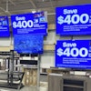 Flat screen TVs displayed at a retail store in Vernon Hills, Ill., Aug. 7, 2025.