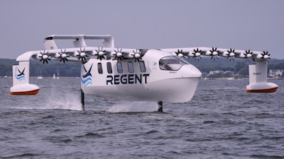 The REGENT Viceroy Seaglider, a winged passenger ferry, glides over the surface of Narragansett Bay on a test run, Wednesday, Aug. 6, 2025, off the coast of North Kingstown, R.I.