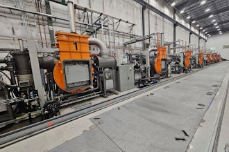 This photo provided by Noveon Magnetics, a row of specialized furnaces that are used to produce rare earth magnets sits inside the Noveon Magnetics plant in San Marcos, Texas.