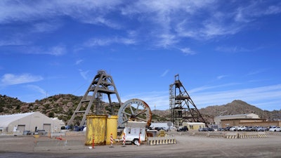 Mine shafts 10, left, and 9, right, tower over the Resolution Copper Mining Company facility, June 9, 2023, in Miami, Ariz.