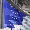 European Union flags flap in the wind outside EU headquarters in Brussels, Thursday, Aug. 21, 2025.