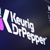 The logo for Keurig Dr. Pepper appears above a trading post on the floor of the New York Stock Exchange, July 12, 2018.