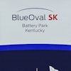 Logos for BlueOval SK and Ford are displayed on a podium during a celebration for the progress of the BlueOval SK Battery Park in Glendale, Ky., Dec. 5, 2022.