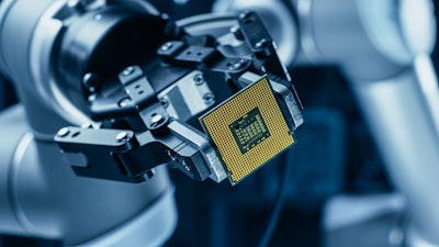 Robot Arm Holding Contemporary Super Computer Processor.