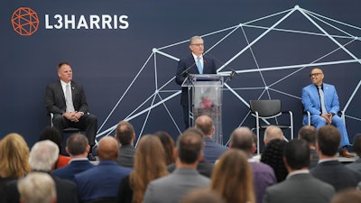 L3Harris Technologies Chair and CEO Christopher E. Kubasik speaks at the opening of the 94,000-square-foot satellite integration and test facility.
