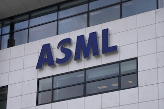 The logo of ASML, a leading maker of semiconductor production equipment, hangs on the head office in Veldhoven, Netherlands, on Jan. 30, 2023.