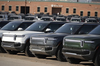 A long line of unsold 2024 R1S electric utility vehicles sits at a Rivian service center Nov. 26, 2024, in east Denver.