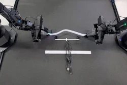 TactileAloha physical AI robot holding velcro.