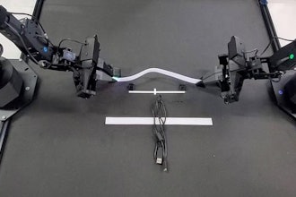 TactileAloha physical AI robot holding velcro.