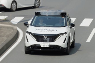 In this image made from video provided by Nissan Motor Co., Japanese automaker Nissan's test vehicle featuring an automated driving system packed with artificial intelligence moves on a road in Tokyo on September, 2025.