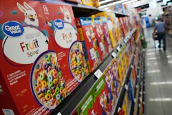 A customer walks past a display of Great Value brand cereal at a Walmart Neighborhood Market, Friday, Sept. 26, 2025, in Bentonville, Ark.