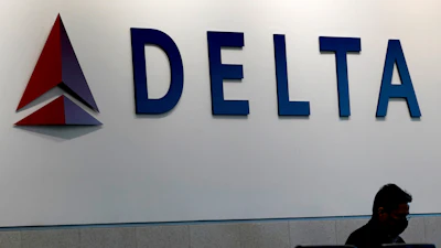 A man waits for a Delta Airlines flight at Hartsfield-Jackson International Airport in Atlanta on Jan. 7, 2022. ()