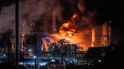 Flames rise from the Chevron refinery in El Segundo, Calif., Thursday, Oct. 2, 2025.