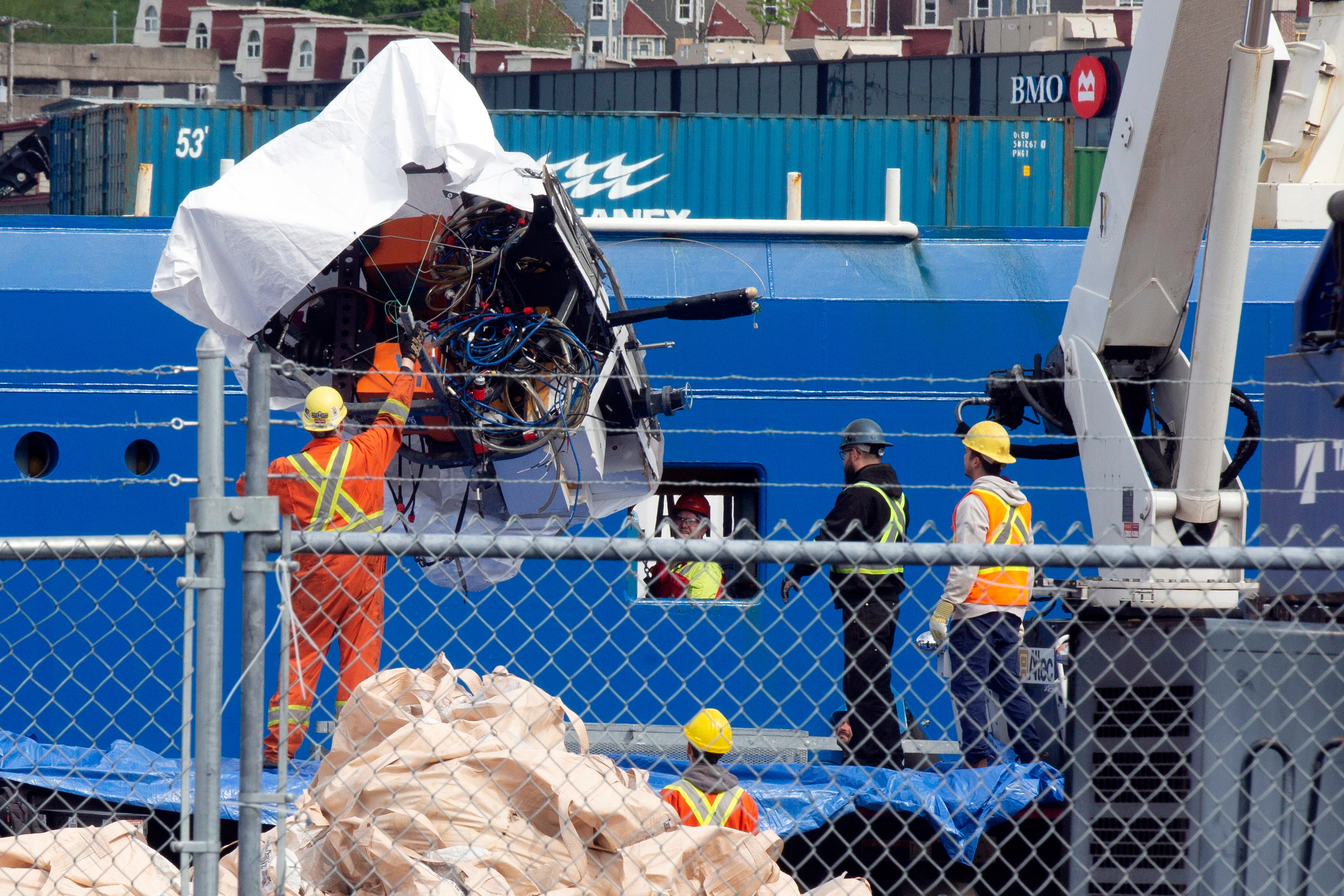 Debris from the Titan submersible, recovered from the ocean floor near the wreck of the Titanic, is unloaded from the ship Horizon Arctic at the Canadian Coast Guard pier in St. John's, Newfoundland, June 28, 2023.