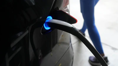 A Tesla car charges at a home in San Francisco, Aug. 25, 2022.
